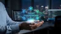 Businessman holding holographic trust framework concept with glowing blockchain cubes in modern office environment for corporate security solutions.