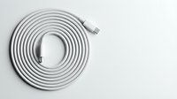 White USB cable coiled in spiral pattern on clean background for technology and connectivity projects.