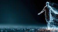 Digital human figure dissolving into particles and light effects on dark background representing transformation and technology concepts.