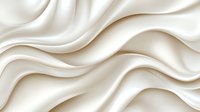 Luxurious white silk fabric with soft flowing waves and elegant folds creates smooth curved lines against light background. Suitable for wedding and fashion designs.