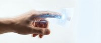 Hand holding glowing digital particles with blue light effects on white background for technology and innovation concepts.