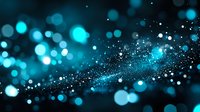 Glowing blue bokeh lights and particles floating in dark space create magical atmosphere with blurred sparkles and luminous dots scattered across background.