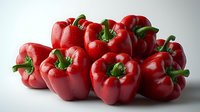 Fresh red bell peppers with bright green stems and water droplets arranged in group on light background, raw organic produce for healthy cooking.