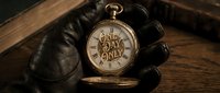 Gloved hand holding antique gold pocket watch with One Day Only text on dial, vintage style limited time offer concept for sales and promotions.