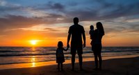 Family silhouettes watching sunset on beach. Parents with children enjoying golden hour by ocean waves. Vacation memories and togetherness concept.