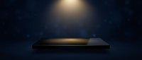 Empty dark podium with warm spotlight and bokeh background for product display and presentation.