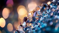 Sparkling crystal bracelet with geometric faceted beads reflecting warm golden light against soft bokeh background for luxury jewelry design.