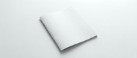 Blank white magazine or brochure mockup lying on a light surface, open with empty pages ready for custom design presentation.