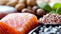 Fresh salmon fillet with assorted nuts, legumes and green leaves showcasing healthy protein sources and omega-3 rich foods for balanced nutrition.