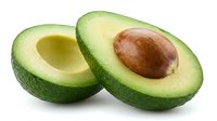 Fresh avocado halves with pit isolated on white background, ready for food photography, culinary design, recipe blogs, and healthy eating content.