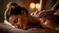 Young woman receiving relaxing back massage with oil in spa setting with warm ambient lighting and peaceful atmosphere.