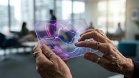 Elderly hands holding futuristic holographic display with purple digital interface in modern office environment for technology and innovation concepts.