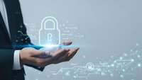 Businessman hand holding digital padlock icon with network connections representing cybersecurity data protection and secure technology solutions.
