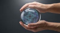 Hands protecting glowing digital network sphere with connected nodes and data lines representing global connectivity and technology protection.