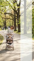 Young mother pushing baby stroller through sunny park pathway with green trees and dappled sunlight creating peaceful family outdoor recreation moment.