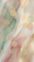 Soft pastel bokeh lights with flowing abstract waves in pink, green and cream tones creating dreamy atmospheric background for romantic designs.