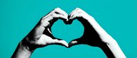 Two hands forming a heart shape together on a vibrant teal background, symbolizing love, unity, and connection for Valentine's Day.