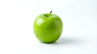 Fresh green apple with water droplets isolated on white background, suitable for food, nutrition, health and wellness design projects.