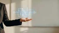 Businessman in suit presenting holographic digital technology interface with glowing circuit patterns and data connections for modern business solutions.