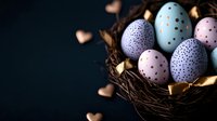 Pastel colored Easter eggs with polka dot pattern nestled in dark nest with golden hearts and leaves on black background. Elegant holiday composition.