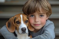 Young Caucasian boy with blonde hair wearing gray sweater hugging affectionate beagle puppy, close-up portrait showing emotional bond between child and pet dog.