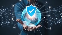 Businessman holding glowing cybersecurity shield with network connections and digital protection icons for data safety and privacy concepts.