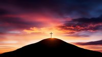 Silhouette of Christian cross on hilltop against dramatic sunset sky with vibrant orange and purple clouds, spiritual and religious background concept.