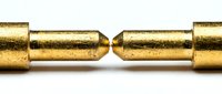 Two golden brass bullet cartridges facing each other on white background, metallic ammunition rounds isolated for military and weapon design concepts.