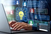 Business professional using laptop with digital innovation interface displaying lightbulb idea concept and team collaboration icons for creative workflow.