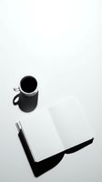 Black coffee in ceramic mug with open blank notebook and pen on white surface, overhead flat lay composition for branding, business, and creative workspace design projects.