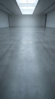 Empty modern gallery space with concrete floor and skylight windows for art exhibitions and creative displays.