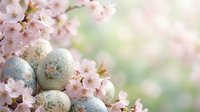 Decorated Easter eggs with floral patterns nestled among blooming cherry blossom branches in soft spring light for seasonal holiday celebrations.