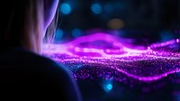 Glowing purple wave of particles with bokeh light effects on dark background creates magical atmosphere for technology and science designs.