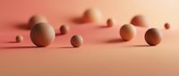 Abstract geometric spheres in warm coral pink tones creating minimalist composition with soft shadows on gradient background for modern design projects.
