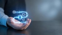 Engineer or technician with light skin tone holding glowing blue holographic gears and cogs, symbolizing innovation, technology, and mechanical engineering solutions for industrial applications.