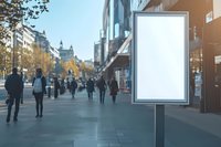 Blank advertising billboard mockup on urban street with blurred people walking in city during autumn day, copy space for marketing display.