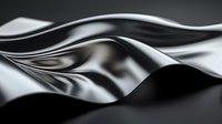 Smooth flowing waves of metallic silver and black create abstract luxury background with dynamic curves and glossy reflective surface. Elegant minimal design.