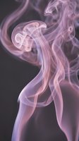 Soft pink and purple smoke swirls elegantly against a dark background, creating a dreamy, abstract flow of curling vapor trails.
