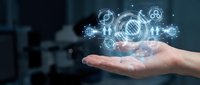 Hand holding glowing digital gears and technology icons representing innovation, engineering, and industrial solutions for business and manufacturing concepts.