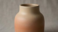 Handmade terracotta vase with rounded body and wide opening, isolated on neutral background, suitable for home decor, interior design, and product styling projects.
