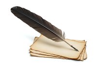 Isolated black feather quill pen resting on aged parchment paper stack against white background, suitable for writing, literature, education, and vintage design projects.