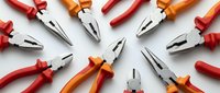 Professional electrician pliers with insulated handles arranged in circular pattern on white background. Essential electrical tools for wire cutting and gripping work.