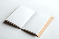 Open blank white book with beige binding on light background showing empty pages ready for content, mockup for branding and design presentation.