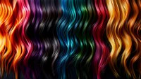 Vibrant wavy strands of multicolored hair flowing horizontally, featuring bright orange, purple, turquoise, red, and golden hues against dark background. For beauty salon promotion.