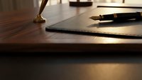 Elegant workspace with luxury fountain pen on leather notebook, warm lighting creates professional atmosphere for business writing and planning.