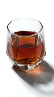 Whiskey or bourbon in geometric faceted glass with ice cubes on white background, suitable for beverage, alcohol, and bar-related projects.