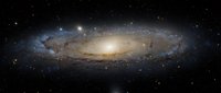 Spectacular spiral galaxy with glowing core and detailed arms against starry cosmic background for astronomy education and space science presentations.