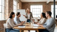 Diverse team of five professionals gathered around wooden table in brick-walled office space, engaged in collaborative business meeting and brainstorming session with flipchart.