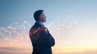 Businessman with arms crossed gazing at horizon with digital network overlay against sunset sky, representing vision, technology and future leadership.