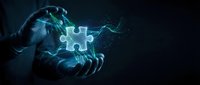 Hands holding glowing puzzle piece on dark background, representing problem solving, innovation, and digital connection for business solutions.